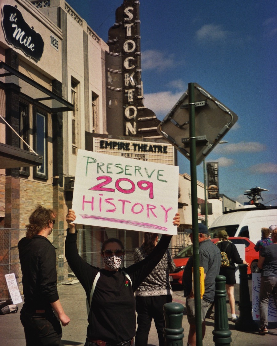 Local community member Natalie Abanavas protesting to save the façade.